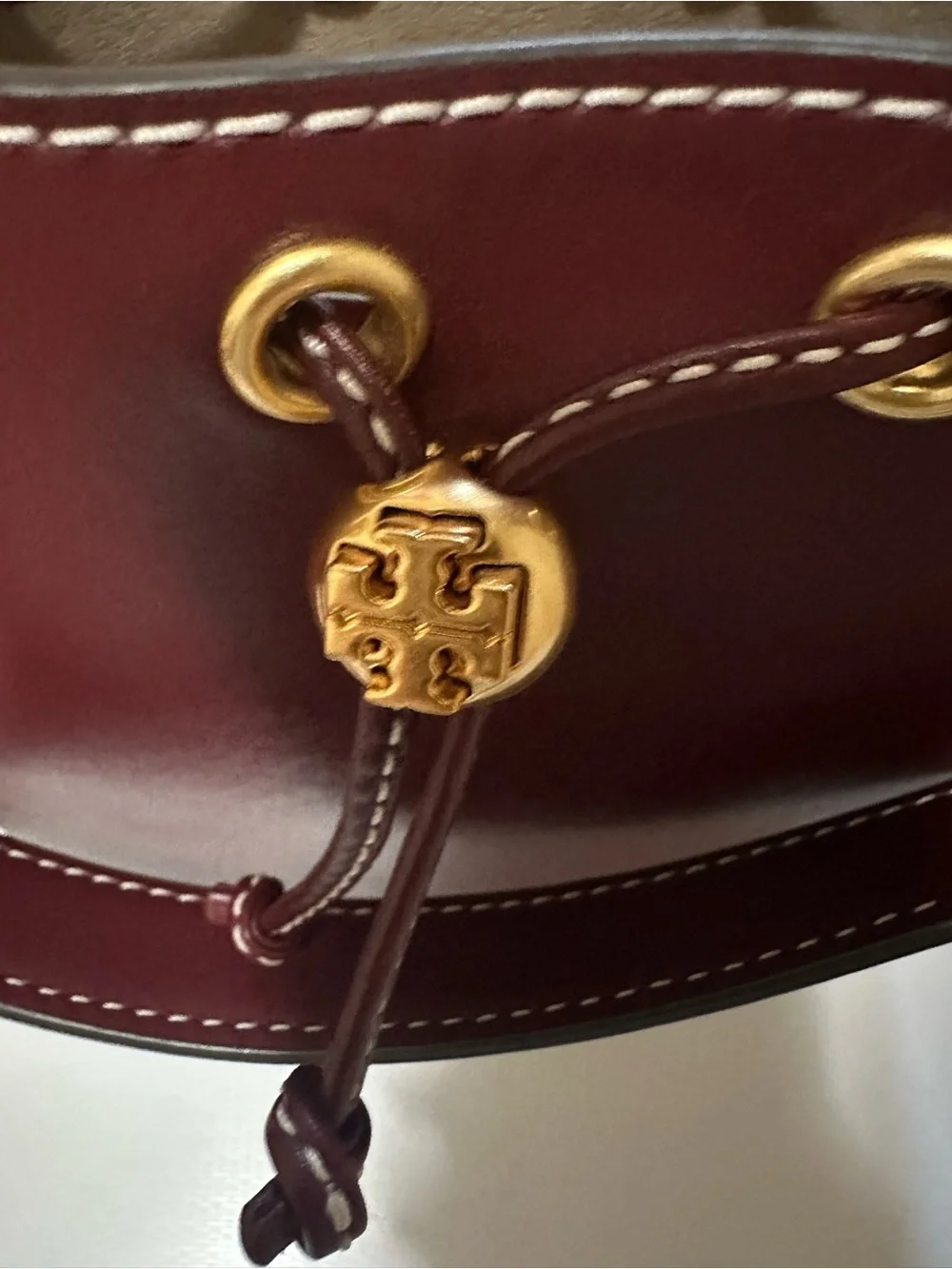 Tory Burch Leather Drawstring Bucket Bag with Gold Hardware in Huckleberry Color